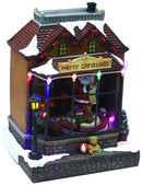 Villaggio Natalizio in Resina Negozio di Babbo con Luci e Suoni 17x15xh23 cm